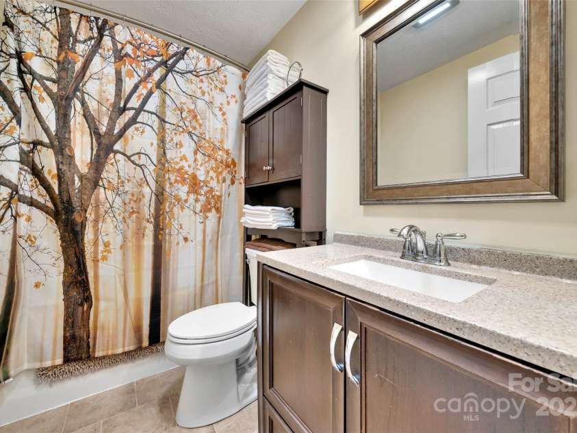 186 Hawks Point Drive, Zirconia, NC 28790.  MLS# CAR4302595, YatesRealty ID 24638. Upper level bathroom