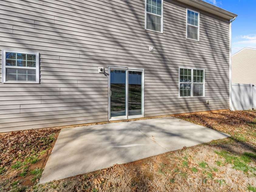 116 Rippling Water Drive, Mount Holly, NC 28120.  MLS# CAR4338264, YatesRealty ID 24647. Concrete patio.