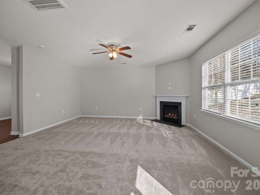 116 Rippling Water Drive, Mount Holly, NC 28120.  MLS# CAR4338264, YatesRealty ID 24647. Great room.