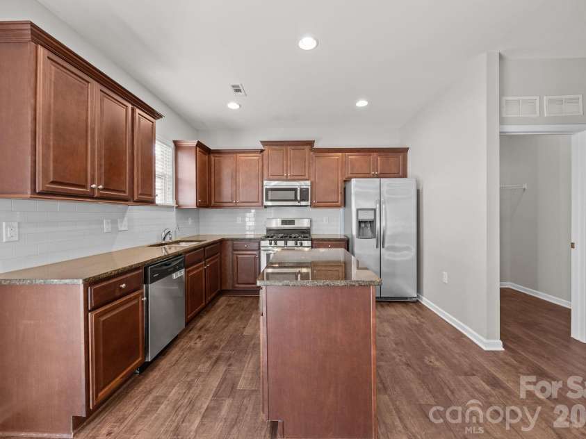 116 Rippling Water Drive, Mount Holly, NC 28120.  MLS# CAR4338264, YatesRealty ID 24647. Kitchen w/granite counters.