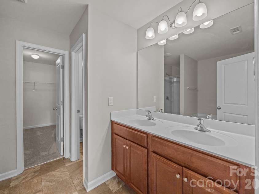 116 Rippling Water Drive, Mount Holly, NC 28120.  MLS# CAR4338264, YatesRealty ID 24647. Primary bathroom.