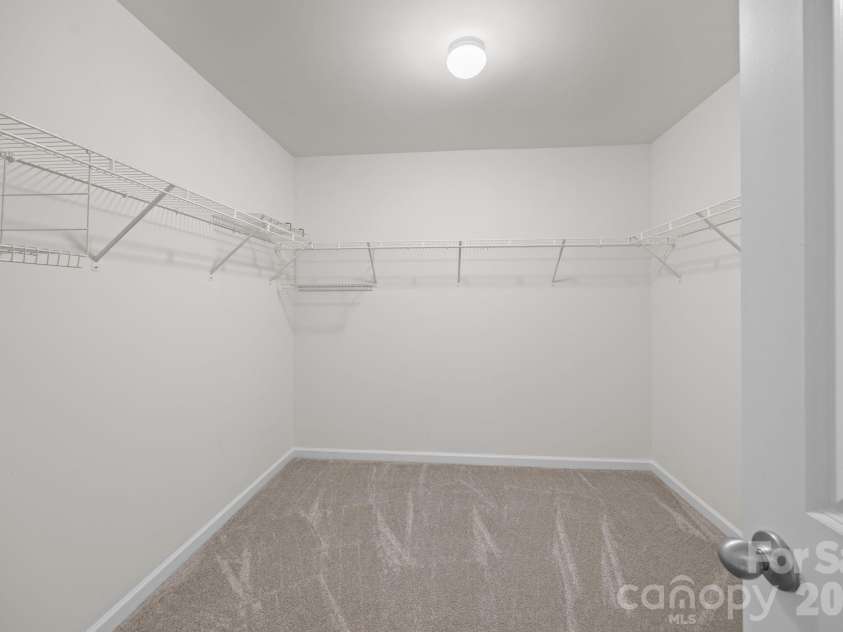 116 Rippling Water Drive, Mount Holly, NC 28120.  MLS# CAR4338264, YatesRealty ID 24647. Primary walk-in closet.