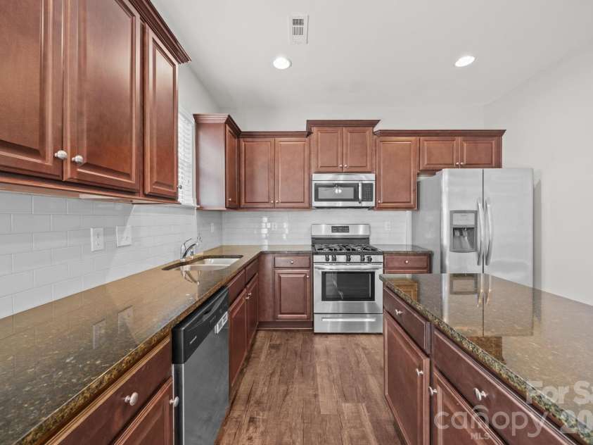 116 Rippling Water Drive, Mount Holly, NC 28120.  MLS# CAR4338264, YatesRealty ID 24647. SS appliances.