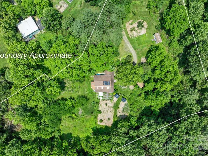 20 Pickens Lane, Weaverville, NC 28787.  MLS# CAR4267121, YatesRealty ID 24647. Aerial shot of house with approximate property line