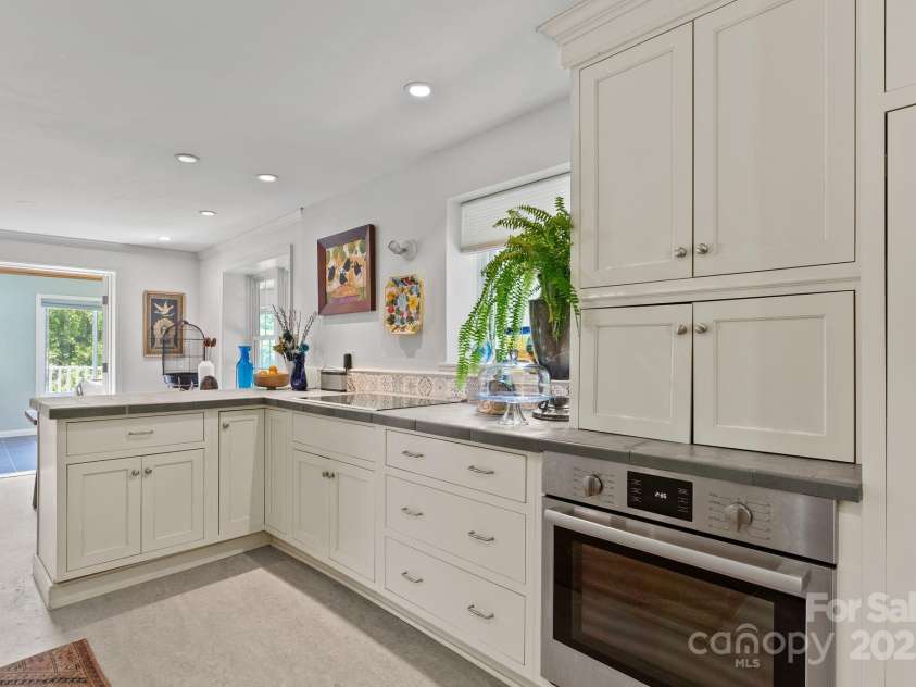 20 Pickens Lane, Weaverville, NC 28787.  MLS# CAR4267121, YatesRealty ID 24647. Kitchen facing dining area