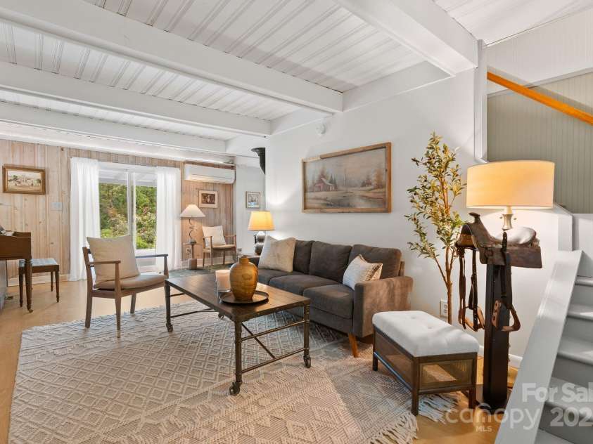 20 Pickens Lane, Weaverville, NC 28787.  MLS# CAR4267121, YatesRealty ID 24647. Living room facing stairs