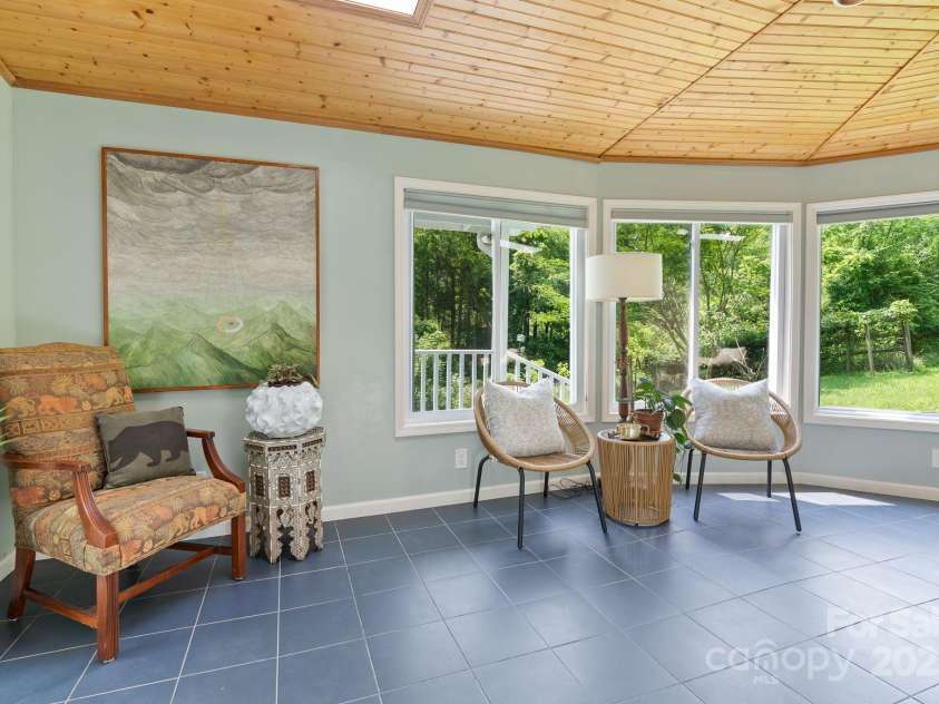 20 Pickens Lane, Weaverville, NC 28787.  MLS# CAR4267121, YatesRealty ID 24647. Sun room from Dining area