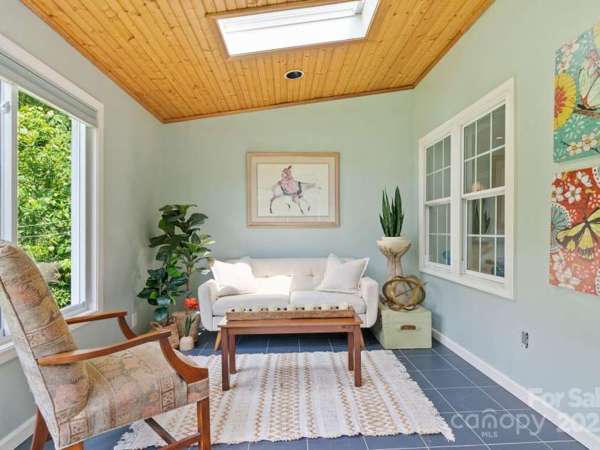 20 Pickens Lane, Weaverville, NC 28787.  MLS# CAR4267121, YatesRealty ID 24647. Sun room sitting ara