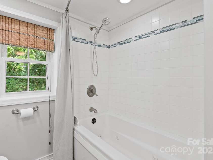 20 Pickens Lane, Weaverville, NC 28787.  MLS# CAR4267121, YatesRealty ID 24647. Upstairs bathroom shower & tub