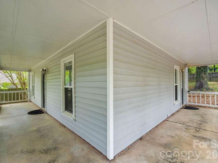 6719 Raeburn Lane, Charlotte, NC 28227.  MLS# CAR4377347, YatesRealty ID 24654. Wrap around porch