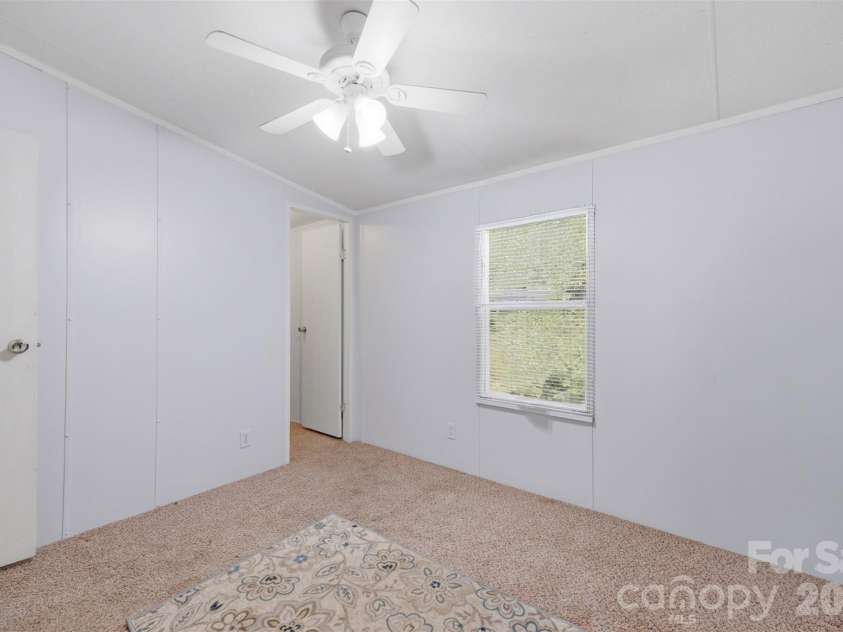 333 Howard Norton Drive, Hiddenite, NC 28636.  MLS# CAR4382521, YatesRealty ID 24658. Bedroom 2 with a walkin closet
