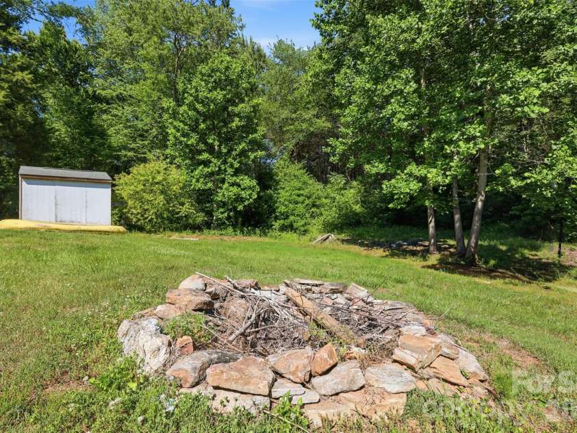 333 Howard Norton Drive, Hiddenite, NC 28636.  MLS# CAR4382521, YatesRealty ID 24658. Fire pit area