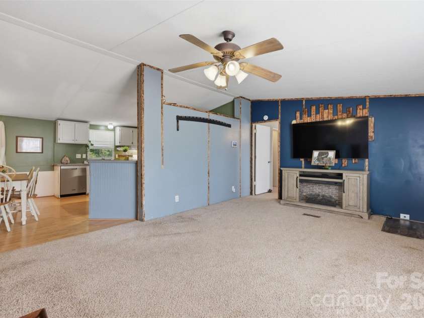 333 Howard Norton Drive, Hiddenite, NC 28636.  MLS# CAR4382521, YatesRealty ID 24658. From living room looking into dining area and kitchen