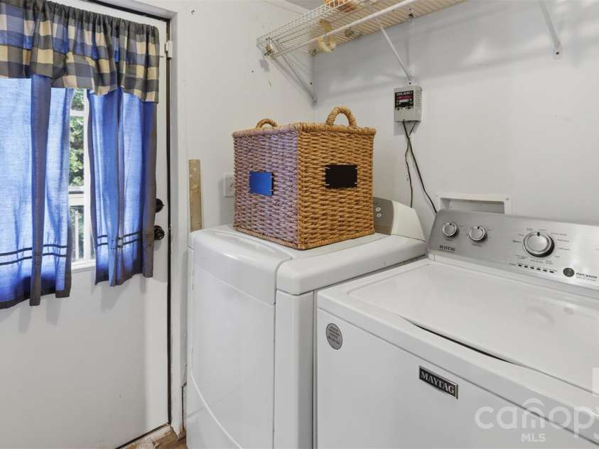 333 Howard Norton Drive, Hiddenite, NC 28636.  MLS# CAR4382521, YatesRealty ID 24658. Laundry area is between kitchen and back deck area