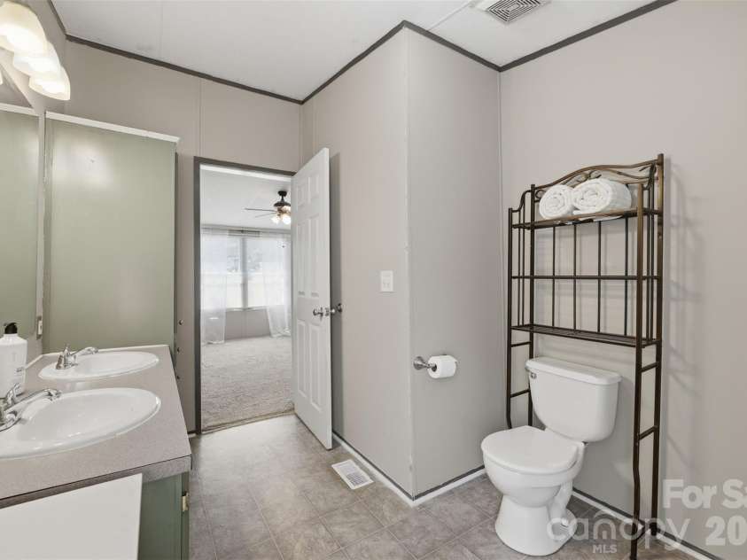 333 Howard Norton Drive, Hiddenite, NC 28636.  MLS# CAR4382521, YatesRealty ID 24658. Primary bathroom with double sink vanity
