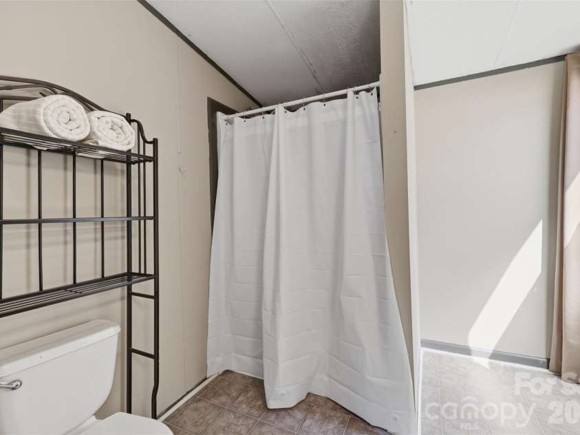 333 Howard Norton Drive, Hiddenite, NC 28636.  MLS# CAR4382521, YatesRealty ID 24658. Primary bathroom with walk in shower