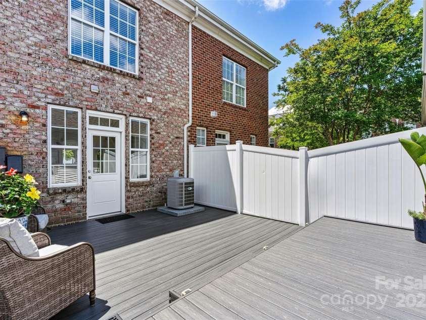 110 Dime Lane, Mooresville, NC 28117.  MLS# CAR4258926, YatesRealty ID 24663. Beautiful patio area just outside of the kitchen. New Trex decking, low maintenance!