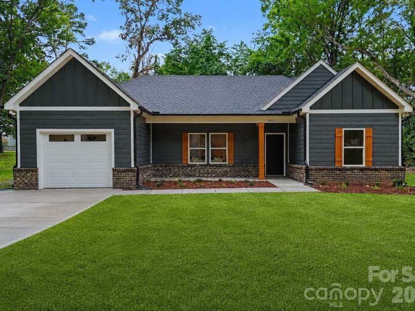 1002 Kingswood Drive, Monroe, NC 28112.  MLS# CAR4385415, YatesRealty ID 24679. Digitally Enhanced Lawn