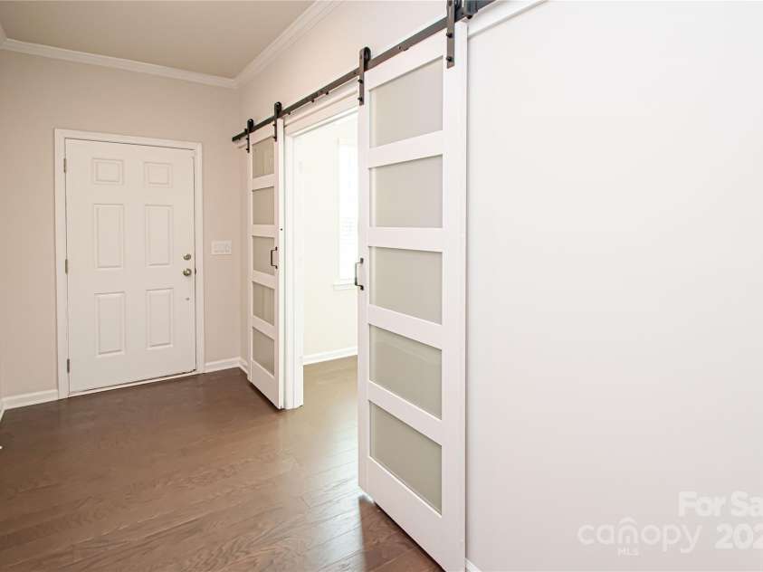 17718 Terryglass Lane, Charlotte, NC 28278.  MLS# CAR4274833, YatesRealty ID 24679. Entryway has a beautiful new barn door that opens into the office