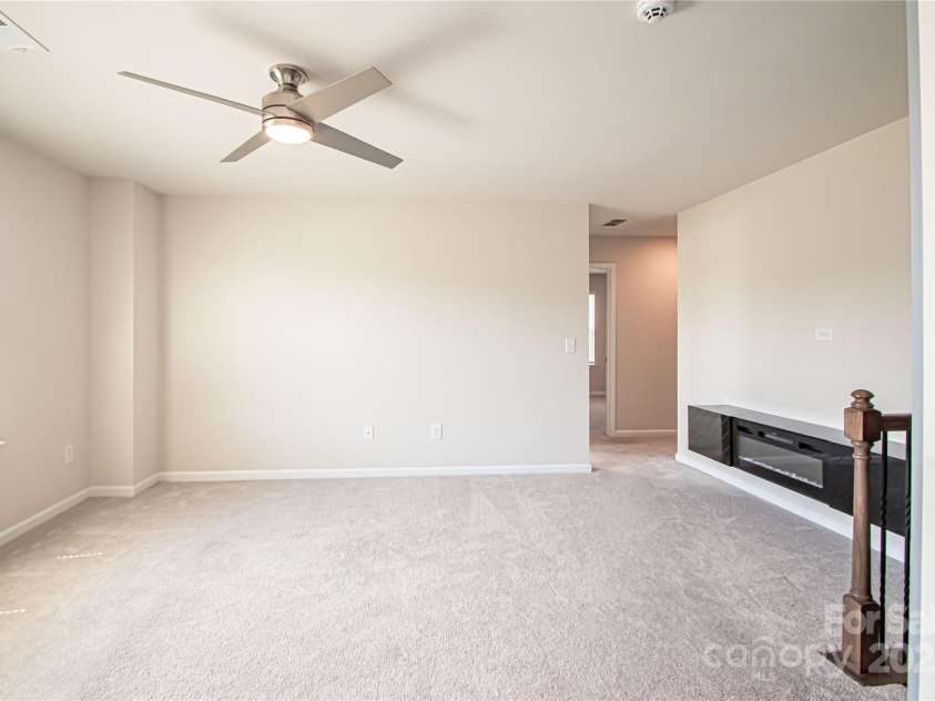 17718 Terryglass Lane, Charlotte, NC 28278.  MLS# CAR4274833, YatesRealty ID 24679. Loft on 2nd level has an electric fireplace