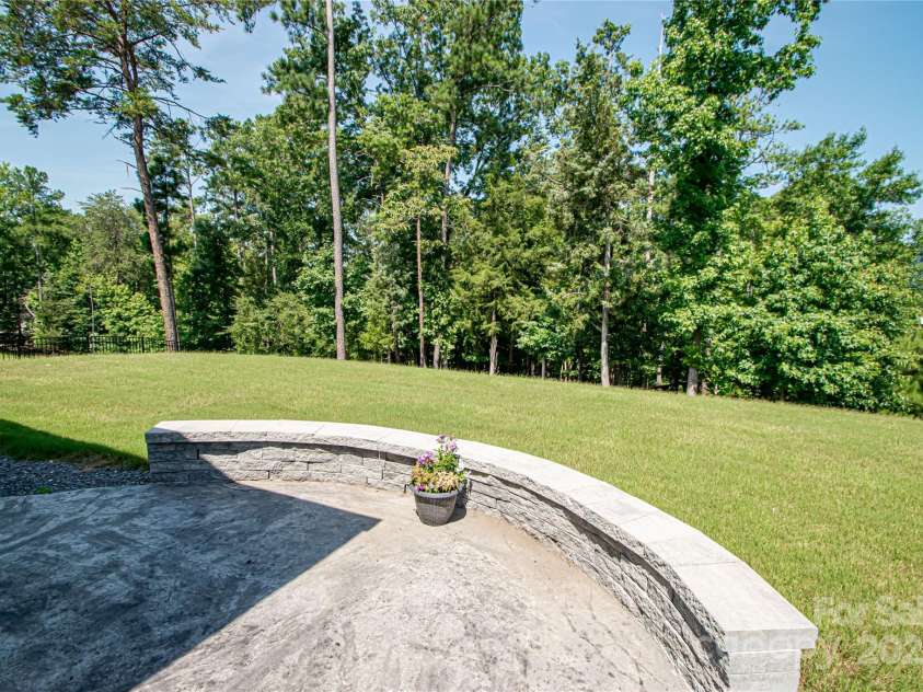 17718 Terryglass Lane, Charlotte, NC 28278.  MLS# CAR4274833, YatesRealty ID 24679. Paver patio and spacious back yard with access to the lake.