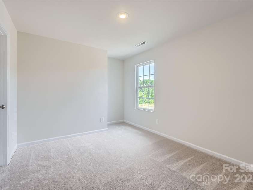 129 Astor Street, Troutman, NC 28166.  MLS# CAR4279370, YatesRealty ID 24688. Secondary Bedroom