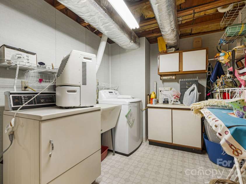 25 Westridge Court, Hendersonville, NC 28791.  MLS# CAR4279623, YatesRealty ID 24700. Laundry