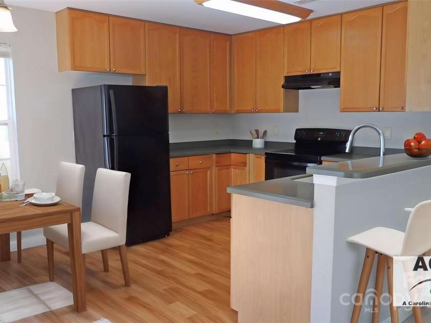 1367 Springview Court, Rock Hill, SC 29732.  MLS# CAR4252984, YatesRealty ID 24713. Dining Area and Kitchen Virtually AI Staged