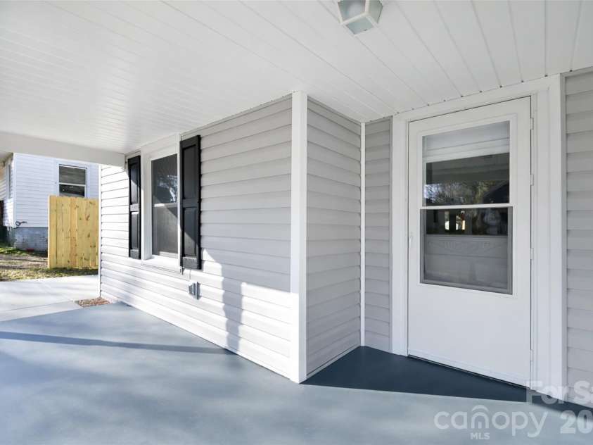 172 Eudy Drive, Concord, NC 28025.  MLS# CAR4338224, YatesRealty ID 24714. Rocking chair Front Portch with swing