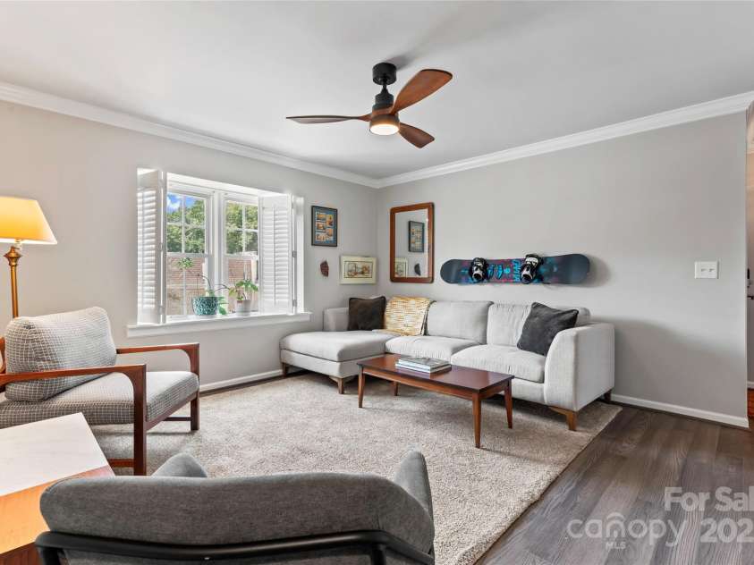 3520 Colony Road, Charlotte, NC 28211.  MLS# CAR4264830, YatesRealty ID 24717. Fantastic living area...inviting, open & bright!  Features include LVP flooring, updated/lighted ceiling fan.  Notice the beautiful windows with plantation shutters!
