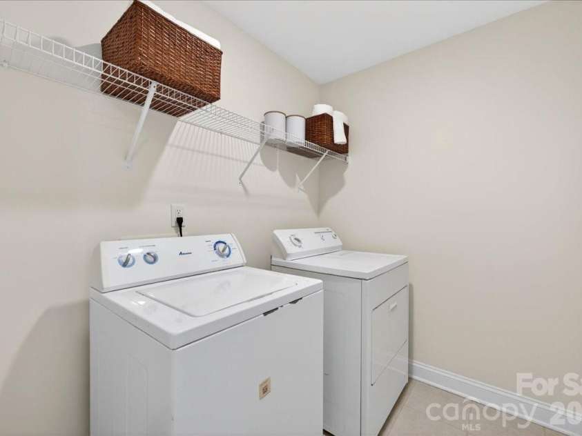 10436 Glenmere Creek Circle, Charlotte, NC 28262.  MLS# CAR4369071, YatesRealty ID 24718. Such a spacious laundry room.