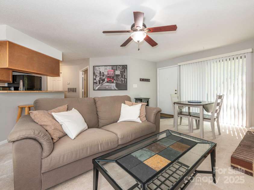 8208 Cedar Glen Drive, Charlotte, NC 28212.  MLS# CAR4265239, YatesRealty ID 24725. Living Room into Dining Area