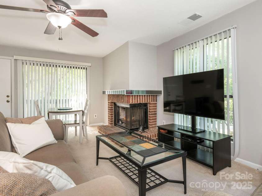 8208 Cedar Glen Drive, Charlotte, NC 28212.  MLS# CAR4265239, YatesRealty ID 24725. Living Room w/ Corner Fireplace