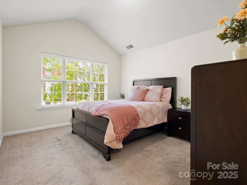 2137 Midnight Blue Lane, Fort Mill, SC 29708.  MLS# CAR4251116, YatesRealty ID 24727. Cathedral ceiling in the primary bedroom