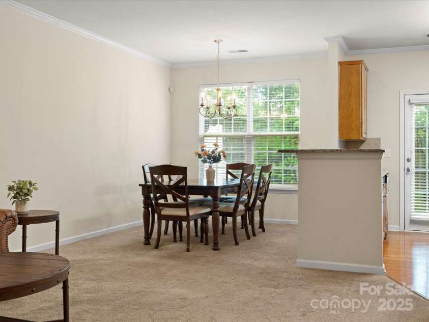 2137 Midnight Blue Lane, Fort Mill, SC 29708.  MLS# CAR4251116, YatesRealty ID 24727. Large dining/breakfast area and an overhang of the bar if you want to add barstools