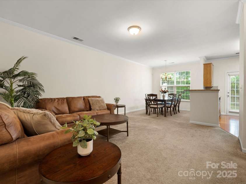 2137 Midnight Blue Lane, Fort Mill, SC 29708.  MLS# CAR4251116, YatesRealty ID 24727. Wide open living room, dining room, and kitchen floorplan with half bath on the main level