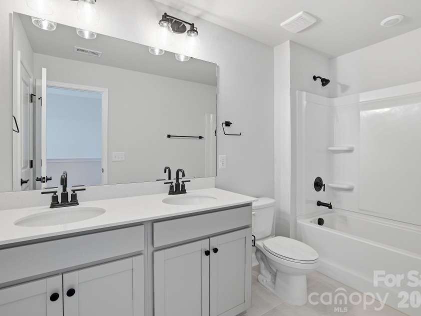4049 Grommet Court, Matthews, NC 28105.  MLS# CAR4325054, YatesRealty ID 24731. Hall bath