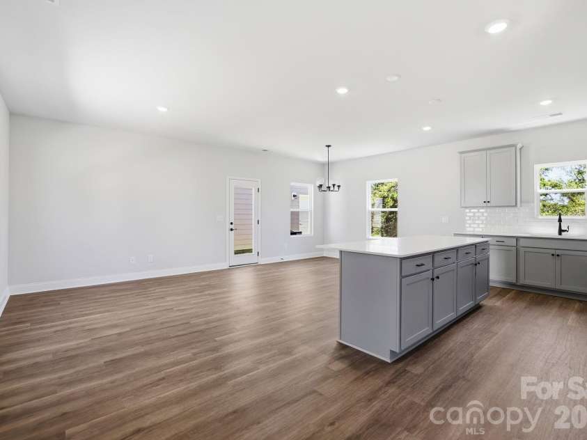 4049 Grommet Court, Matthews, NC 28105.  MLS# CAR4325054, YatesRealty ID 24731. Open living area