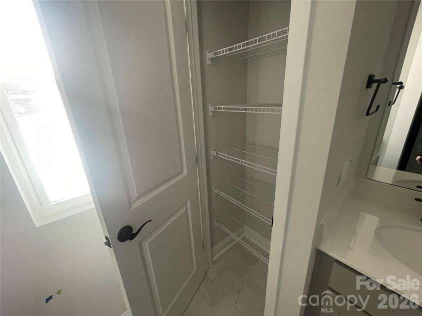 4049 Grommet Court, Matthews, NC 28105.  MLS# CAR4325054, YatesRealty ID 24731. Primary Linen Closet 