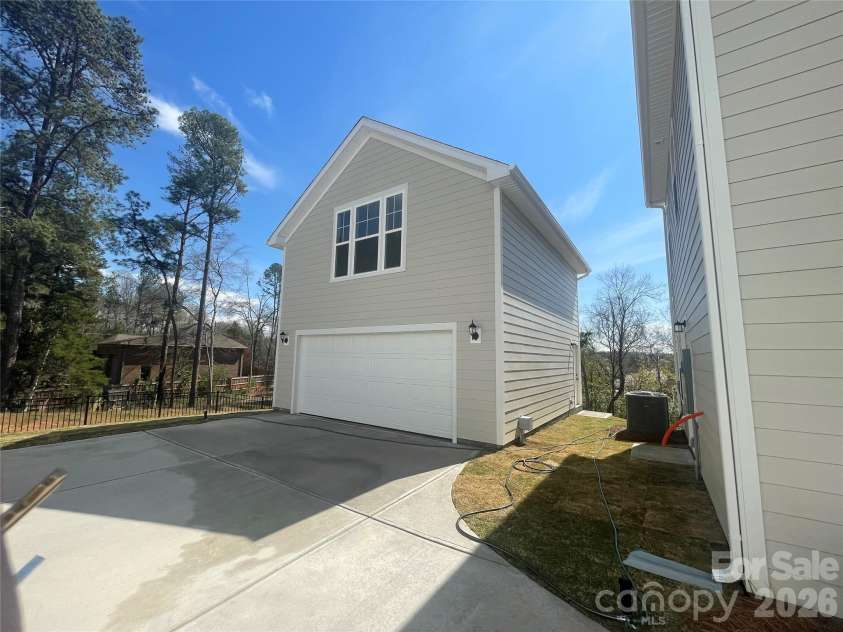 4049 Grommet Court, Matthews, NC 28105.  MLS# CAR4325054, YatesRealty ID 24731. Rear Detached, 2 car garage with finished bonus above complete with full bath, wetbar and walk in storage