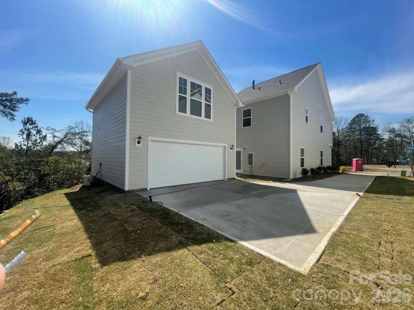 4049 Grommet Court, Matthews, NC 28105.  MLS# CAR4325054, YatesRealty ID 24731. Rear Detached, 2 car garage with finished bonus above complete with full bath, wetbar and walk in storage
