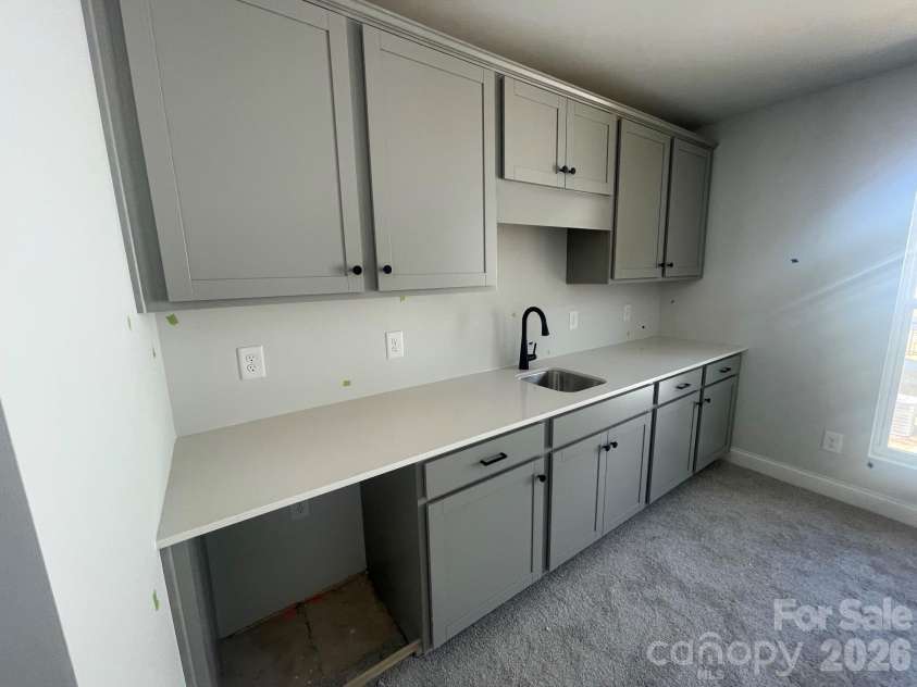 4049 Grommet Court, Matthews, NC 28105.  MLS# CAR4325054, YatesRealty ID 24731. Wetbar in garage bonus