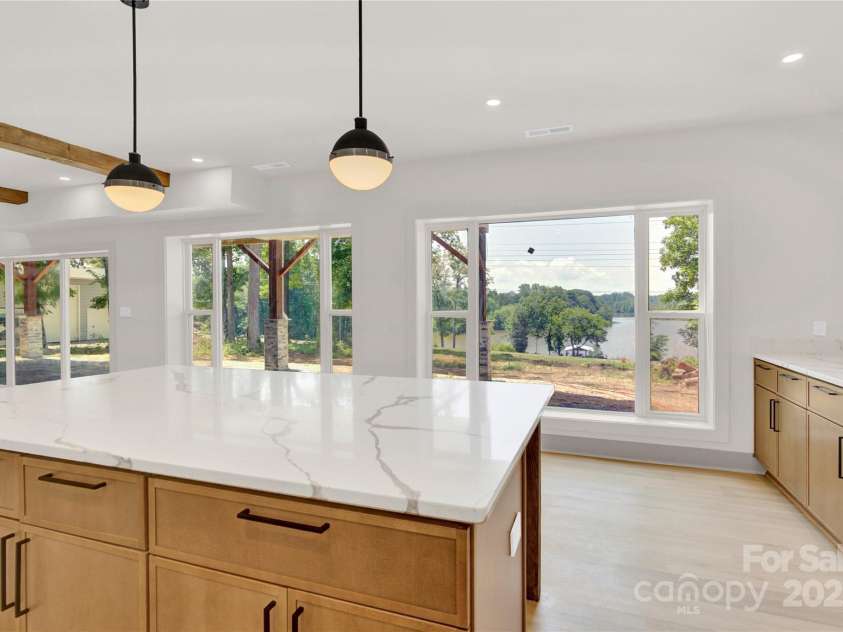 124 Clipper Lane, Mooresville, NC 28117.  MLS# CAR4253640, YatesRealty ID 24732. Basement kitchen has huge island to allow for additional seating