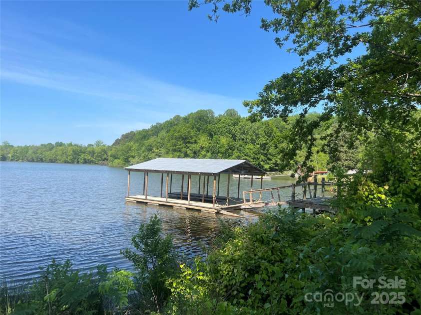 124 Clipper Lane, Mooresville, NC 28117.  MLS# CAR4253640, YatesRealty ID 24732. Covered dock minutes from main channel