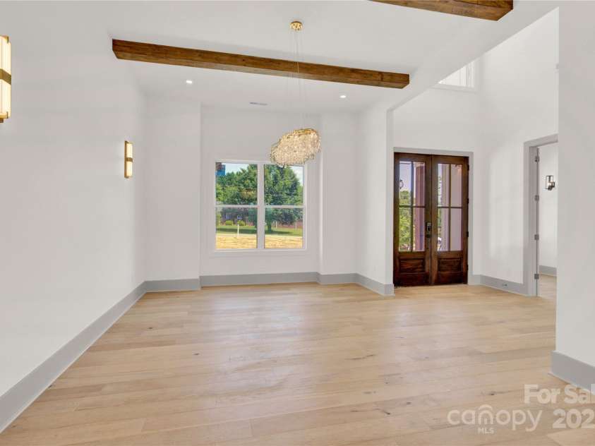 124 Clipper Lane, Mooresville, NC 28117.  MLS# CAR4253640, YatesRealty ID 24732. Dining room with wood beams
