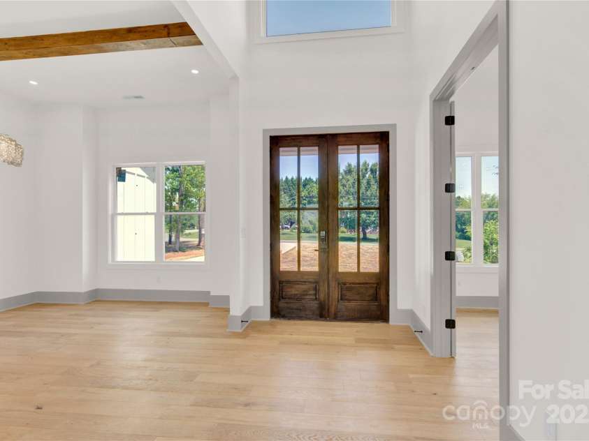 124 Clipper Lane, Mooresville, NC 28117.  MLS# CAR4253640, YatesRealty ID 24732. Grand entry with 12' ceiling and office off foyer