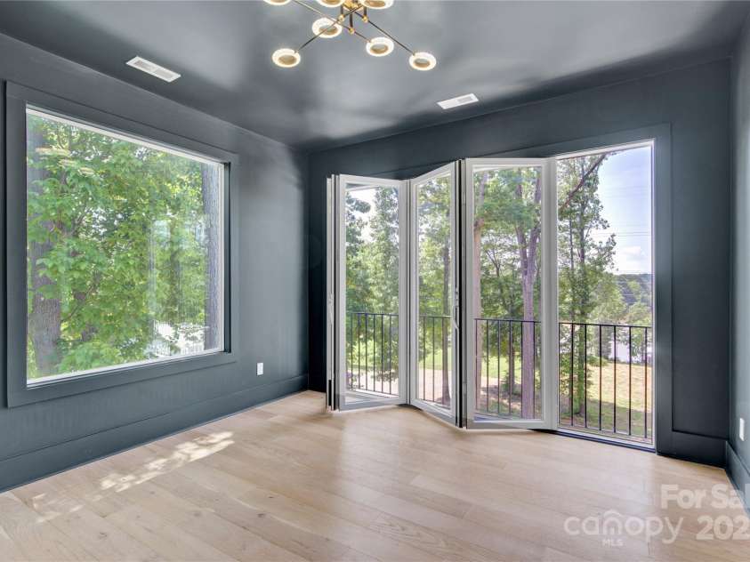 124 Clipper Lane, Mooresville, NC 28117.  MLS# CAR4253640, YatesRealty ID 24732. Upper level game room with pocket doors