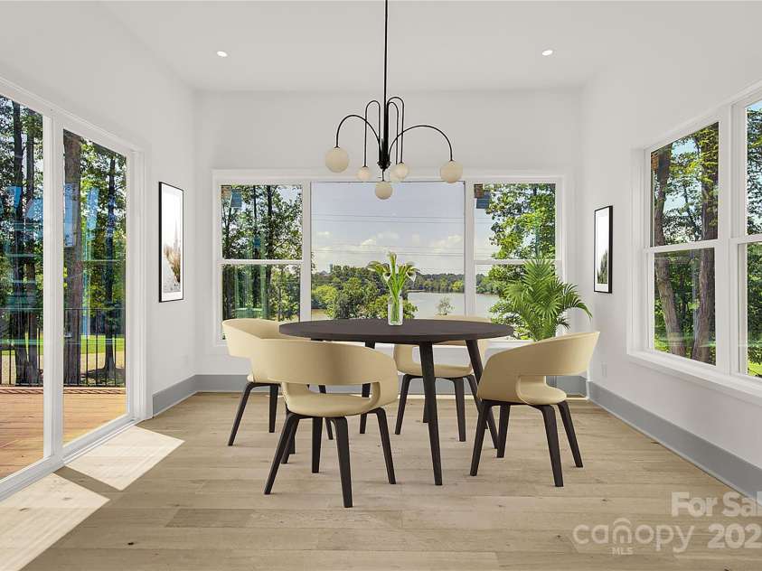 124 Clipper Lane, Mooresville, NC 28117.  MLS# CAR4253640, YatesRealty ID 24732. Virtually staged breakfast nook with lake views and access to large patio