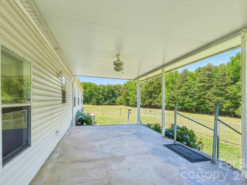 160 Allison Road, Cowpens, SC 29330.  MLS# CAR4331351, YatesRealty ID 24732. Back porch and fenced in area
