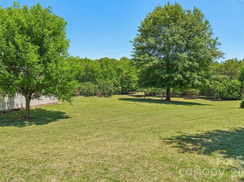 160 Allison Road, Cowpens, SC 29330.  MLS# CAR4331351, YatesRealty ID 24732. View from behind garage